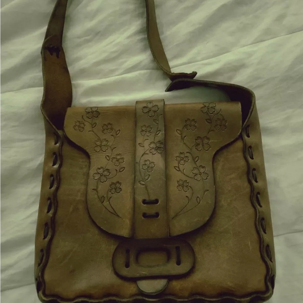 Vintage leather bag with tooled flowers on front